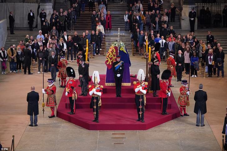 The Queen's grandchildren stood vigil at Her Majesty's coffin this evening at Westminster Hall (pictured L-R: Prince of Wales, Peter Phillips, James, Viscount Severn, Princess Eugenie, the Duke of Sussex, Princess Beatrice, Lady Louise Windsor and Zara Tindall)